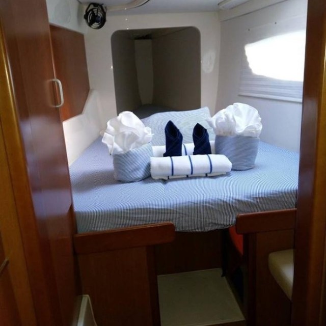 a bedroom with a bed and a mirror