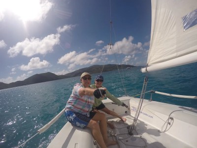 a person standing next to a body of water