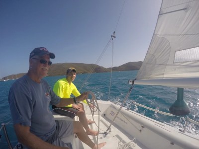 a man standing next to a boat