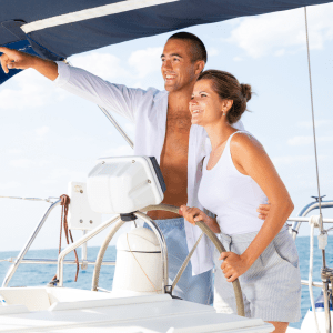 a man and a woman standing on a boat