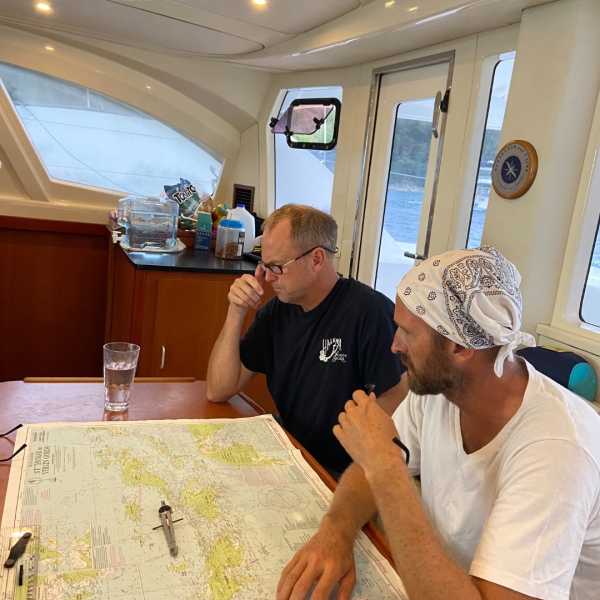 a man standing on top of a cutting board