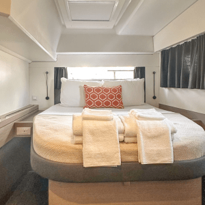 a bedroom with a bed and luggage