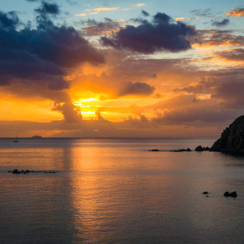 a sunset over a body of water