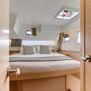 a bedroom with a bed and a mirror