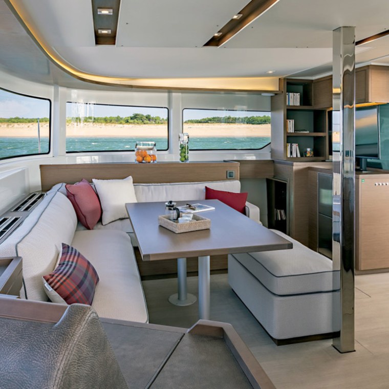 a room filled with furniture and a large window