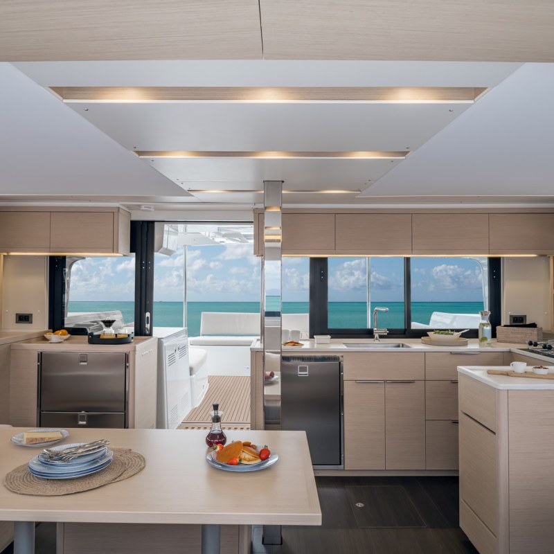 a modern kitchen with an island in the middle of a room