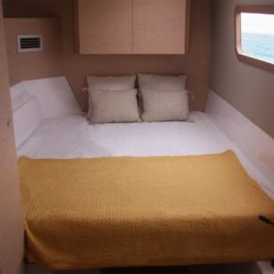 a bedroom with a bed and desk in a room