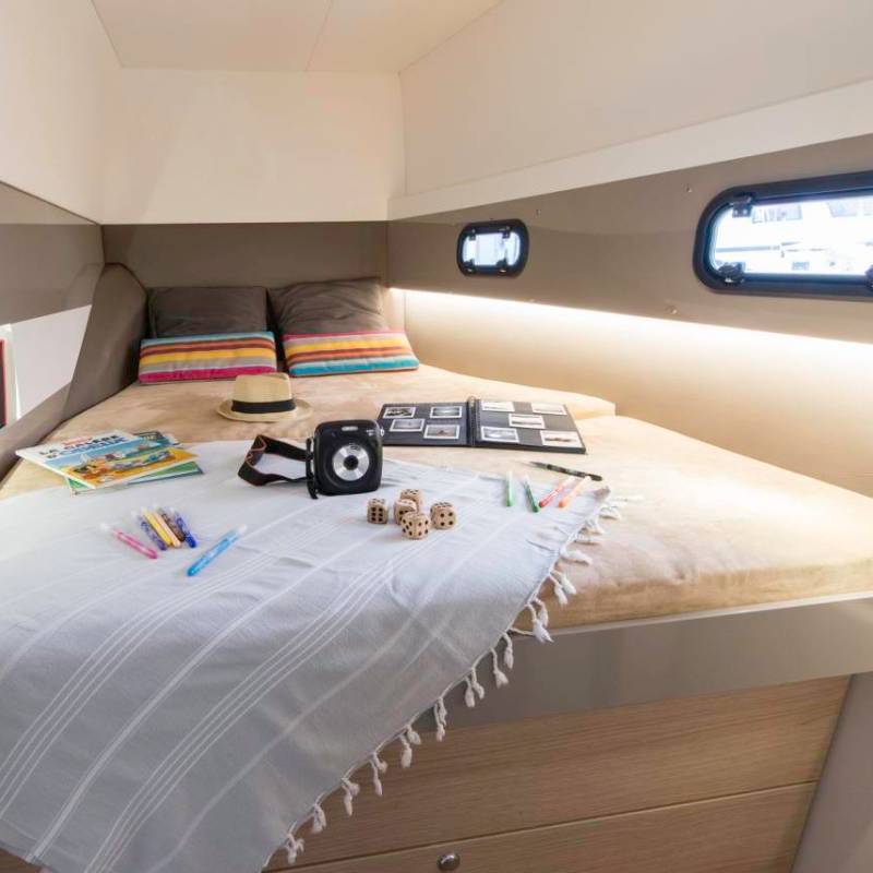 a bedroom with a bed and desk in a room