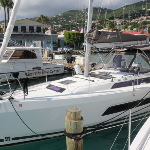 a boat is docked next to a body of water