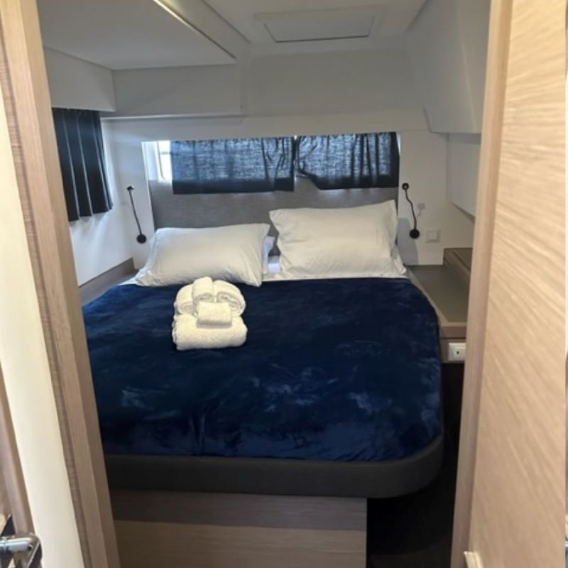 a bedroom with a bed in a room
