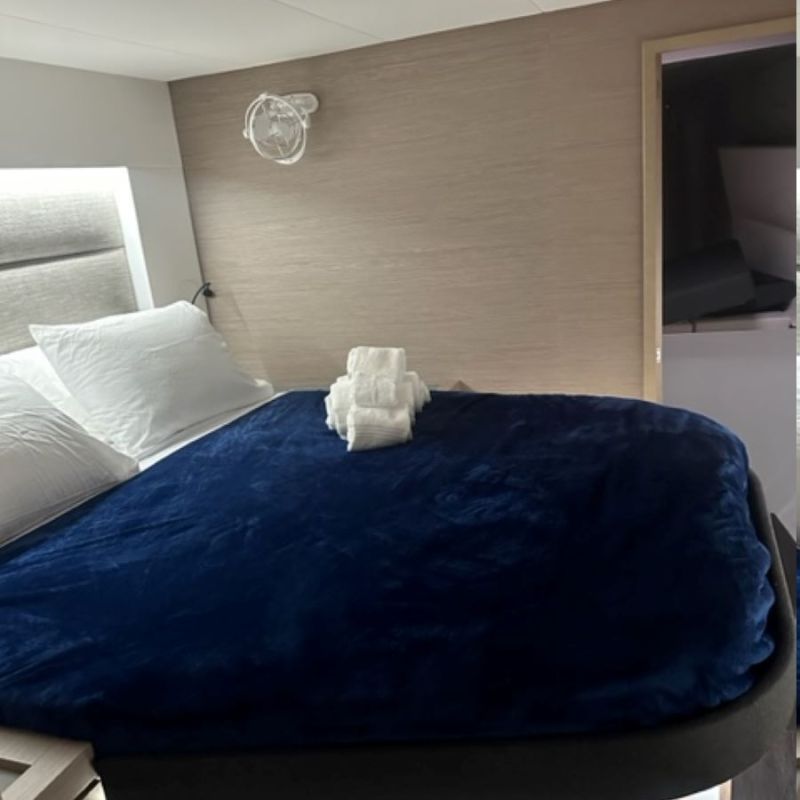 a bedroom with a bed and desk in a room