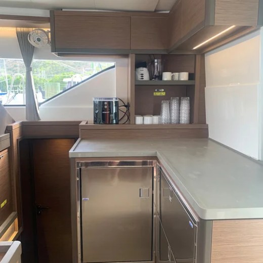 a kitchen with stainless steel appliances and wooden cabinets