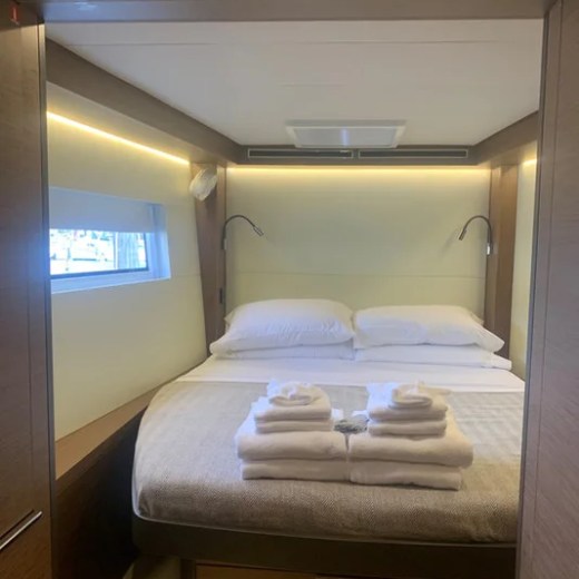 a bedroom with a bed and a mirror