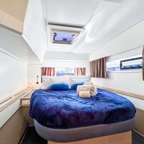 a bedroom with a bed in a room