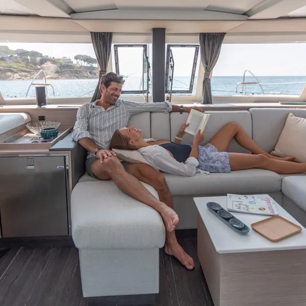 a person sitting at a table in front of a window