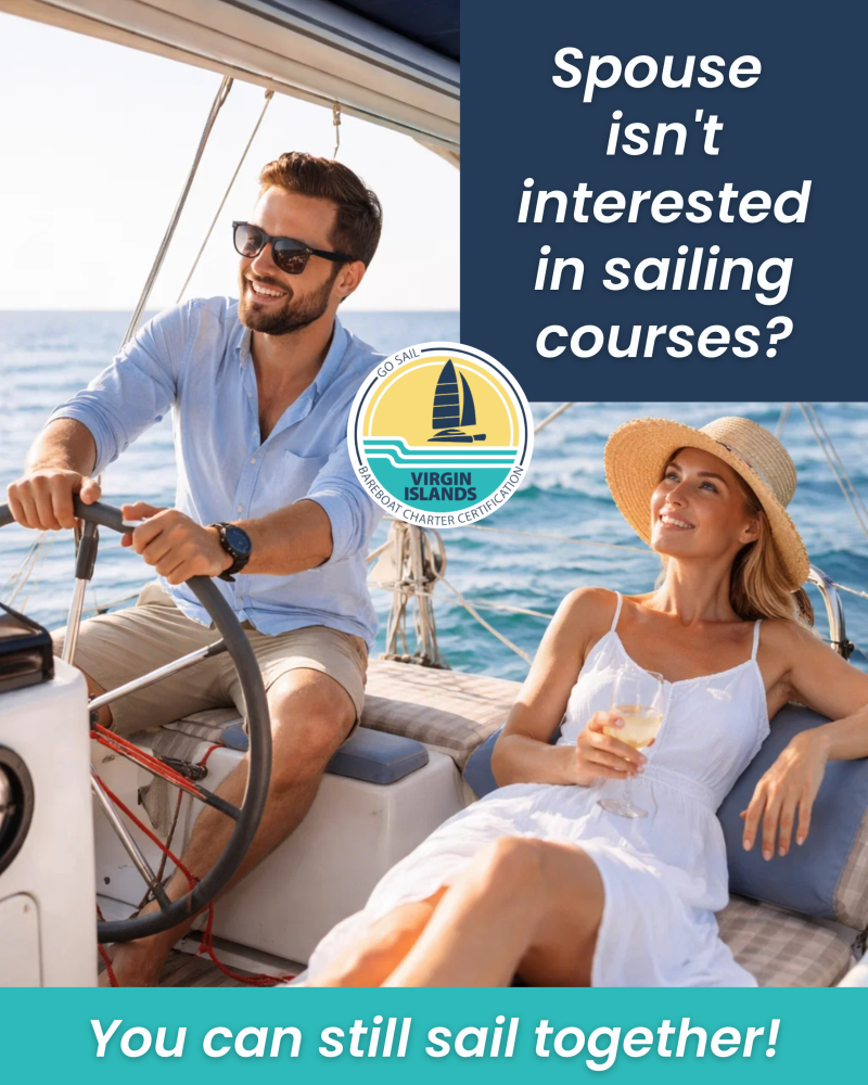 Couple on a sailboat; man steering and woman relaxing with drink.
